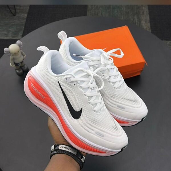 Nike Vomero Plus White Sneakers with Bright Crimson Accents