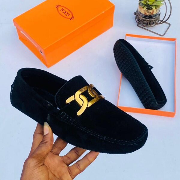 Tod’s Black Loafers with Gold-Tone Chain Detail
