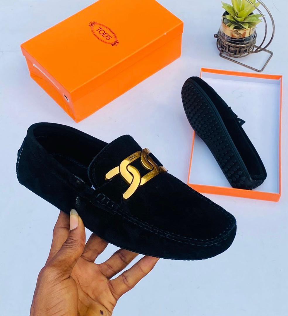Tod’s Black Loafers with Gold-Tone Chain Detail Tod’s Black Loafers with Gold-Tone Chain Detail