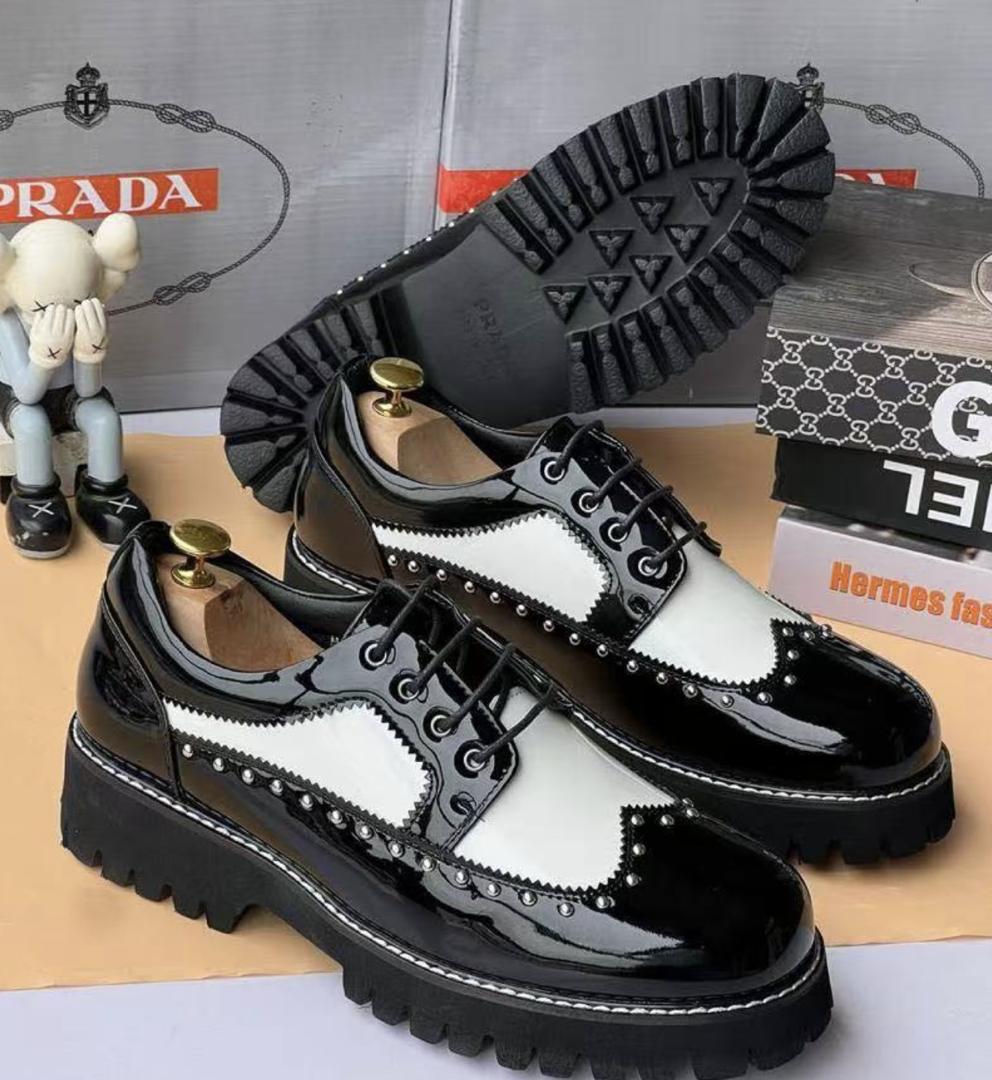 WhatsApp Image 2026-05-06 at 5.01.15 AM (1) Prada Two-Tone Studded Wingtips – Black Patent & White Contrast Lug Sole - Image 1